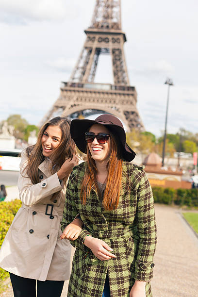 istock Smiling young women holding hands and having fun in Paris 635790248