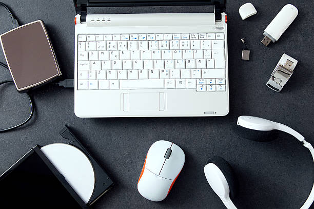Computer peripherals & laptop accessories. Composition on stone stock photo