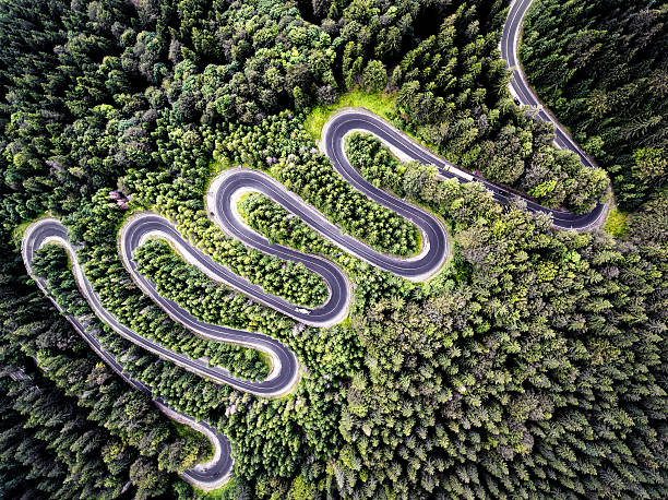 istock Drone view of a curvy road in Romania 635792478
