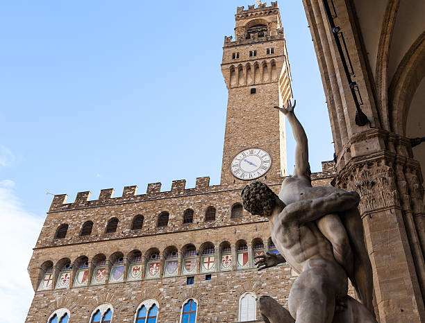 sculpture Rape of Sabine Women and Palazzo Vecchio travel to Italy - sculpture The Rape of the Sabine Women and Palazzo Vecchio on Piazza della Signoria in Florence city. palazzo vecchio stock pictures, royalty-free photos & images