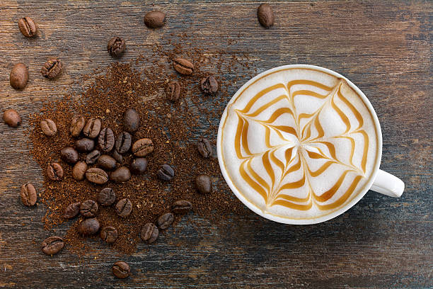 caramel cappuccino with ground top view. - cappuccino latté coffee high angle view imagens e fotografias de stock