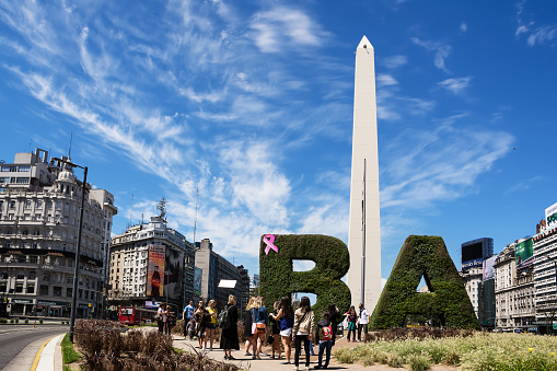 Buenos Aires, Argentina - October 30, 2016: Obelisk and tourist in the center of Buenos Aires in a sunny day of spring