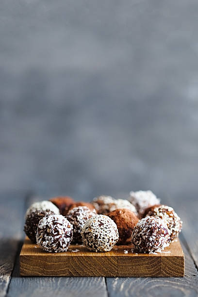 Healthy raw energy balls on a grey background
