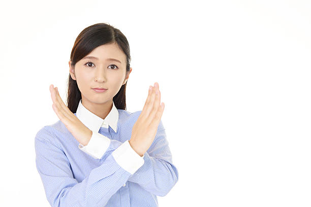 istock Woman demonstrating prohibiting gesture 635794536