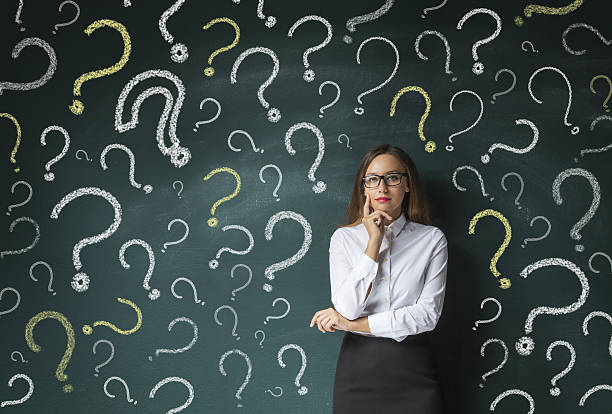 istock Young woman thinking with blackboard 635795422