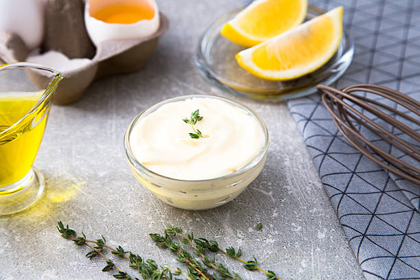 istock Fresh homemade white sauce Mayonnaise and ingredients 635797034