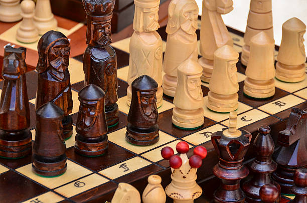 istock Chess board and pieces made from wood 635797876