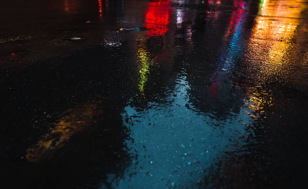 istock NYC streets after rain with reflections on wet asphalt 635798964