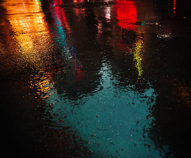 istock NYC streets after rain with reflections on wet asphalt 635798992