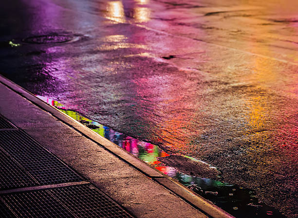 istock NYC streets after rain with reflections on wet asphalt 635799046