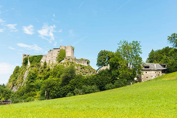 Ruins of Finkenstein castle on a steep cliff in Finkenstein am Faaker See, Austria