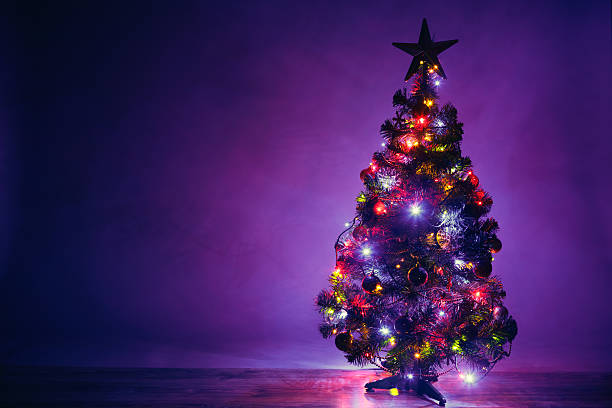 istock Christmas tree artistic silhouette with lights garland 635811376