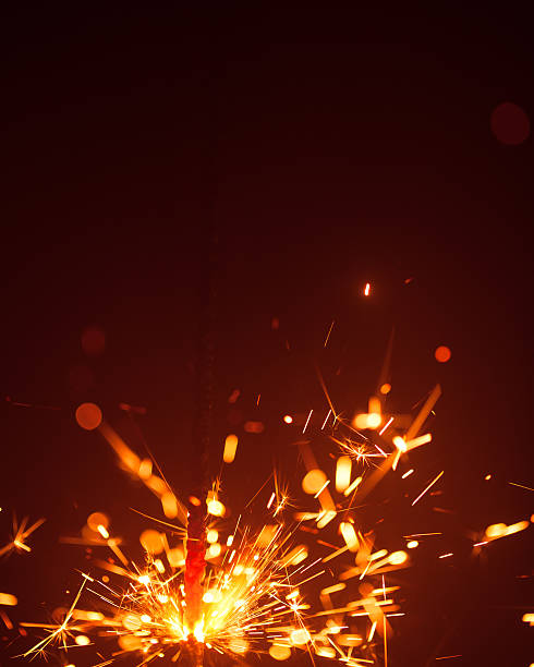istock Christmas sparkler in haze with red light 635811534