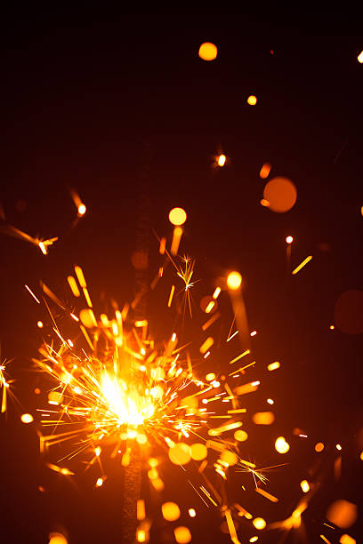istock Christmas sparkler in haze with red light 635811546