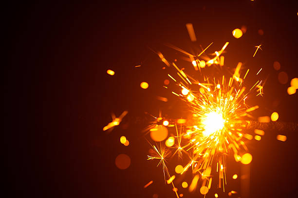istock Christmas sparkler in haze with red light 635811570