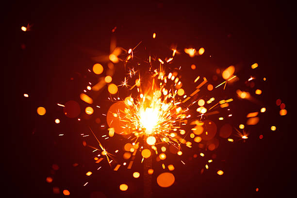 istock Christmas sparkler in haze with red light 635811696