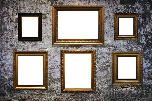 istock wooden picture frame on old wall background 635812478