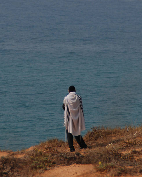 istock Praying by the sea 635815082