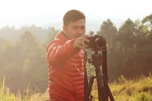 istock Adjusting the camera of the photographer's hand 635815100