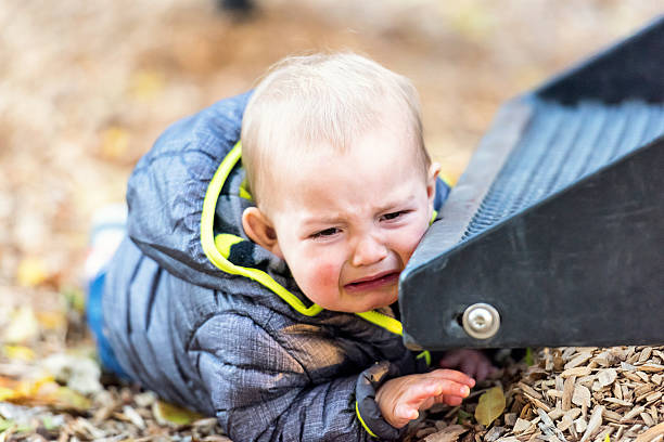 istock crying baby at the park 635815262