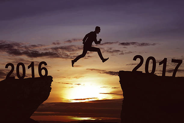 istock Man jumping on the hill toward 2017 635815924