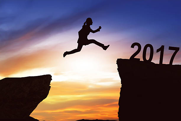 istock Woman jumping on the hill toward 2017 635816792