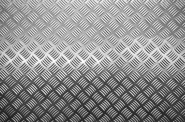 istock New metal diamond floor plate light and shadow texture background 635817532