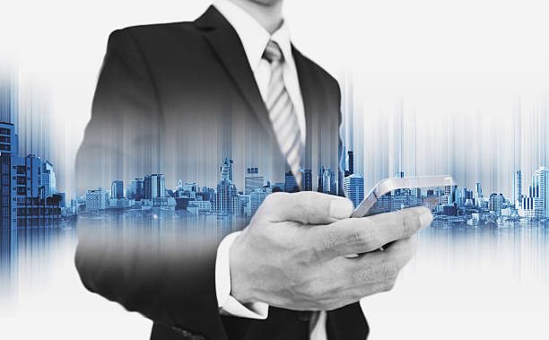 istock Businessman using smartphone, with double exposure city, business communication technology 635818552