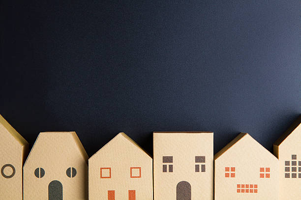 istock Home architectural model paper box cubes on black background 635821270