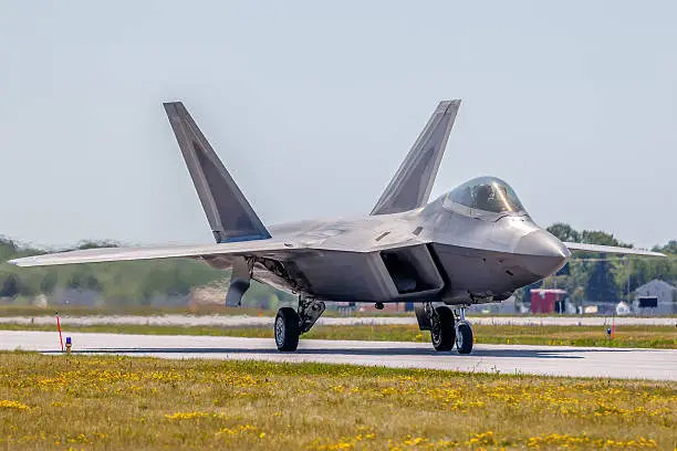 An F-22 Raptor fighter aircraft taxiing for take-off