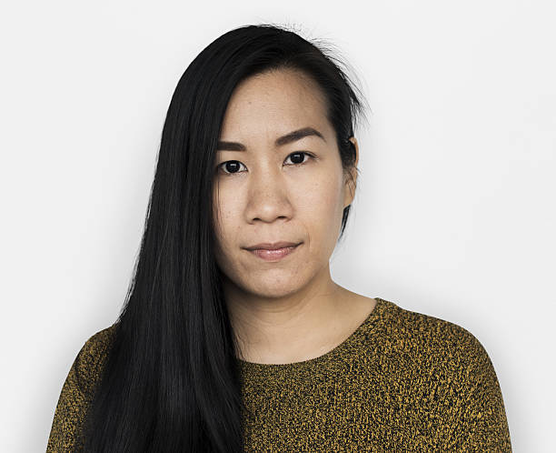 istock Asian Woman Front View Serious Concept 635821814