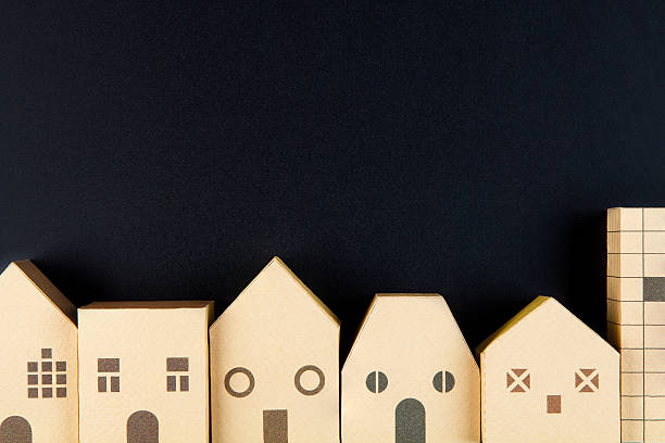 istock Home architectural model paper box cubes on black background 635821930