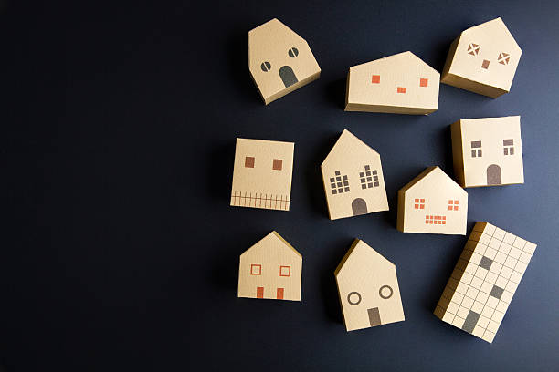 istock Home architectural model paper box cubes on black background 635821960