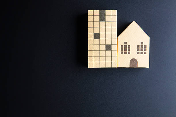 istock Home architectural model paper box cubes on black background 635822056