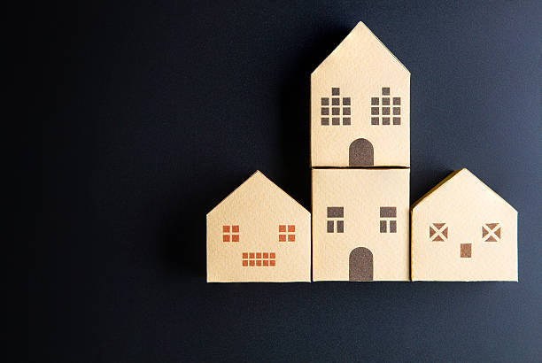 istock Home architectural model paper box cubes on black background 635822198