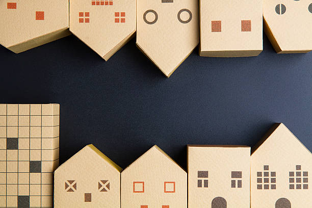 istock Home architectural model paper box cubes on black background 635822374