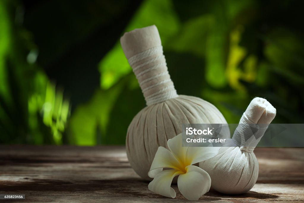 massage bags close up view of  white Herbal Compress on color back.  Aromatherapy Stock Photo