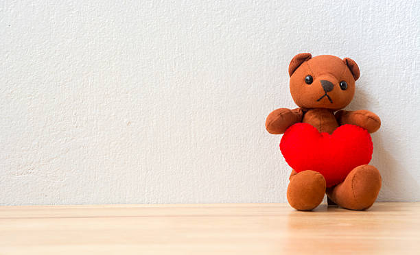 istock Bear with Heart on wood table 635829114