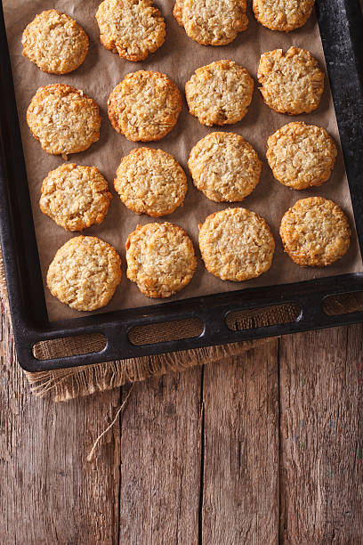istock Australian oatmeal cookies close-up on a baking sheet. vertical 635829716