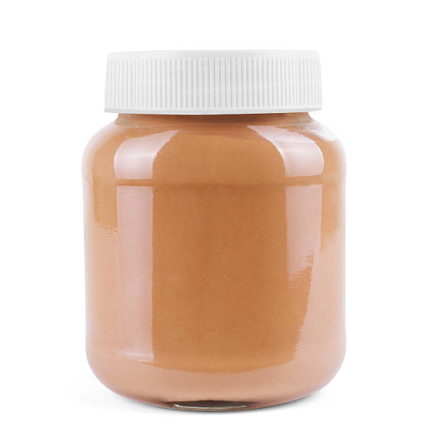 istock Jar of peanut butter, cutout on white background 635836952