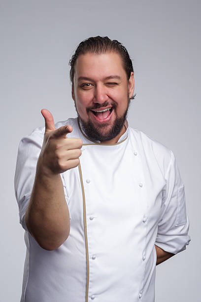 istock Pleased chef laughs and shows thumbs up. 635838168