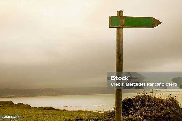 Trail Sign Post With Seascape Background Stock Photo - Download Image Now - Arrow Symbol, Backgrounds, Beach