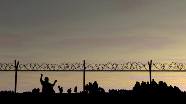 Refugee camp behind barbed wire.