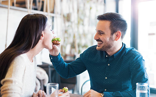 istock Beautiful young couple sitting in a cafe, having breakfast 635840592