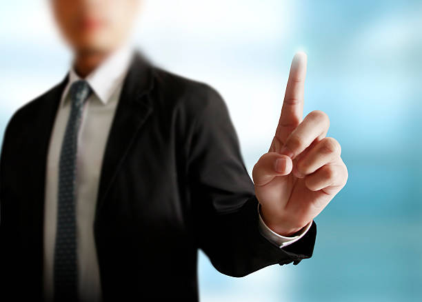 istock businessman with financial symbols 635840994