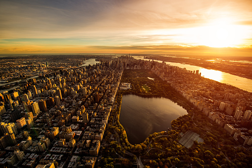 Helicopter point of view of Central Park in New York, USA during the golden hour.