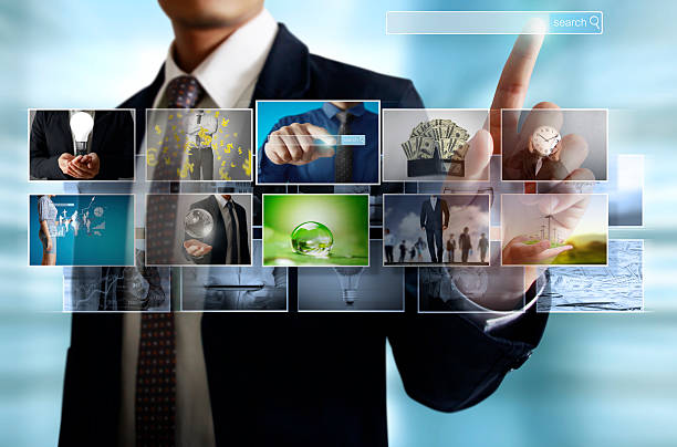 istock businessmen and Reaching images streaming 635844618