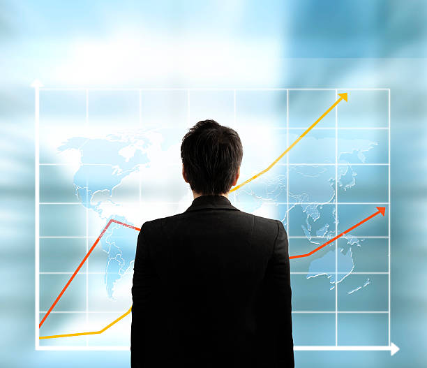istock Businessman with financial symbols 635844810