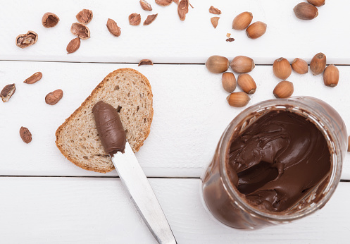chocolate spread with knife and bread