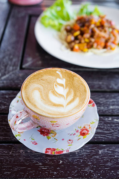 istock cup of coffee on wooden table 635845356